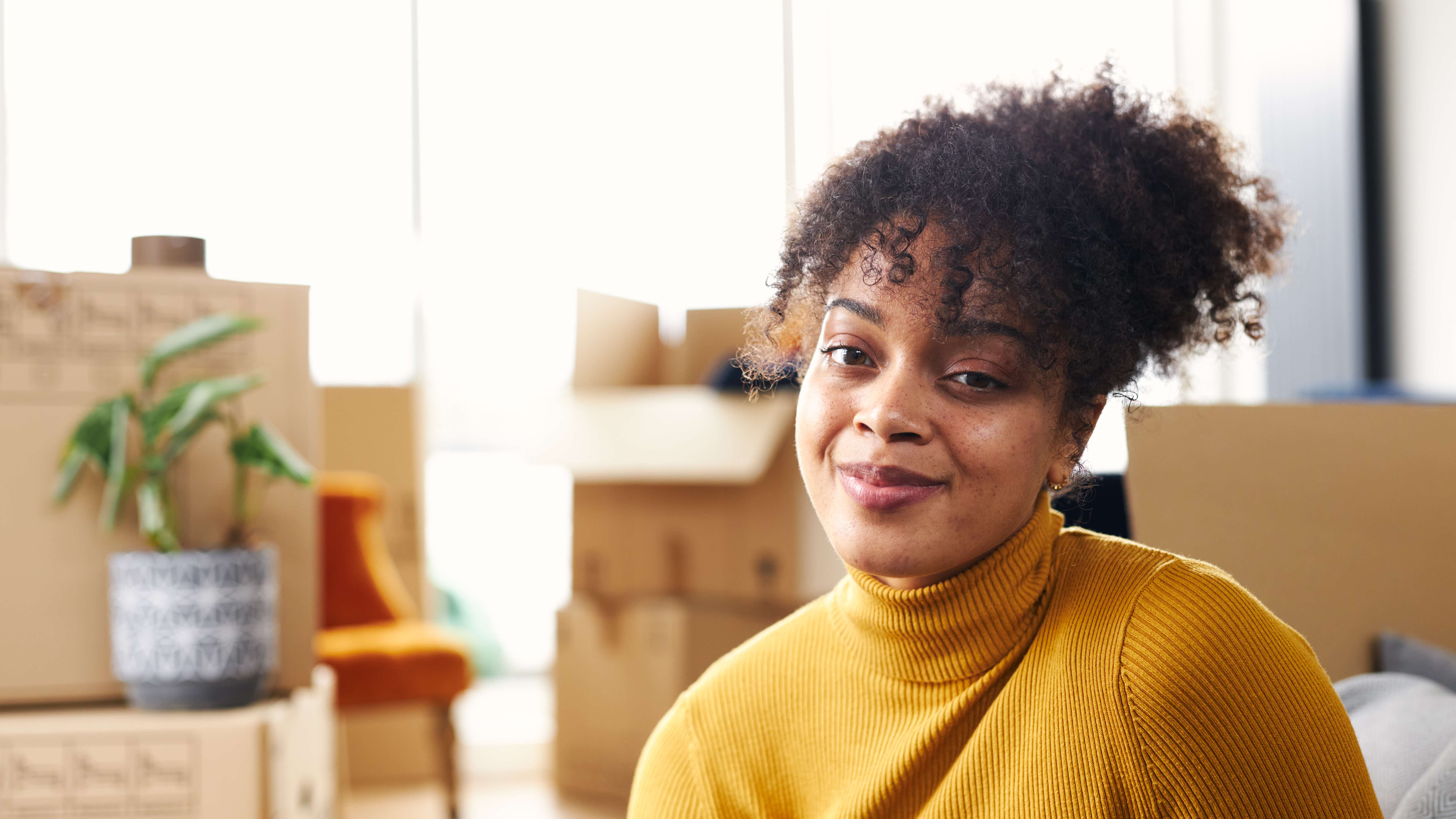 A young woman who has just moved into her new home