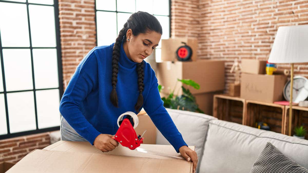 Woman packing boxes as she moves house