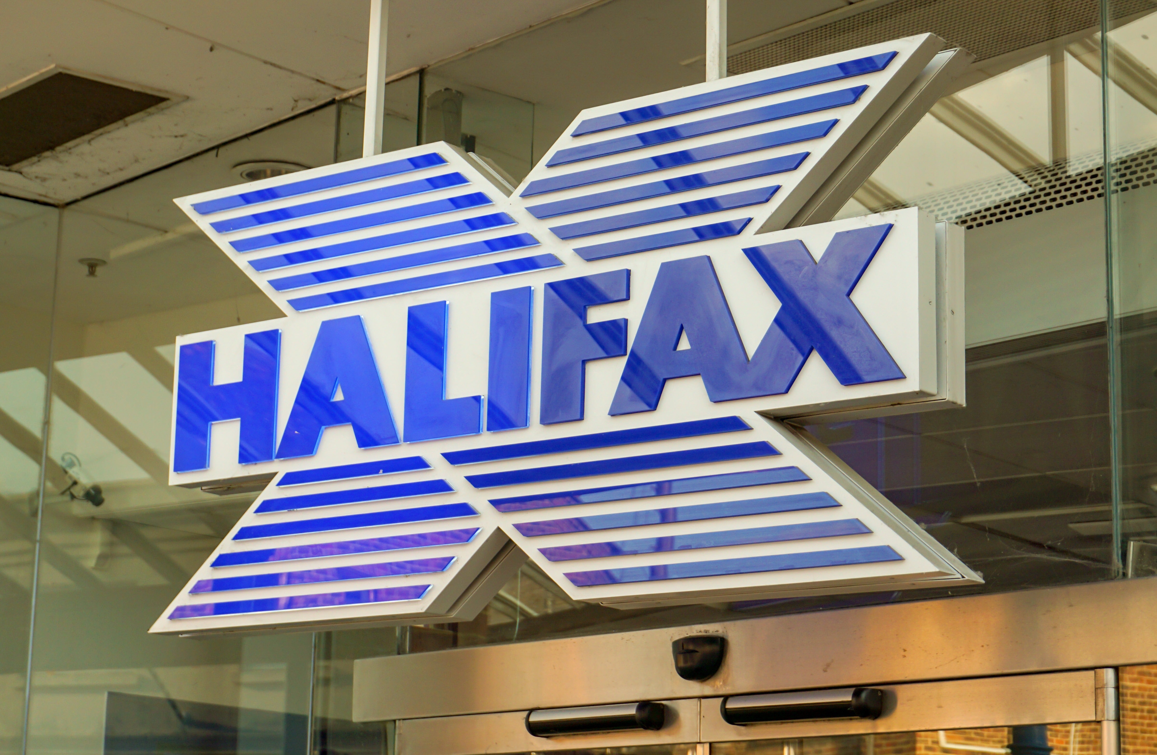 A photo of the logo sign outside of a UK branch of Halifax