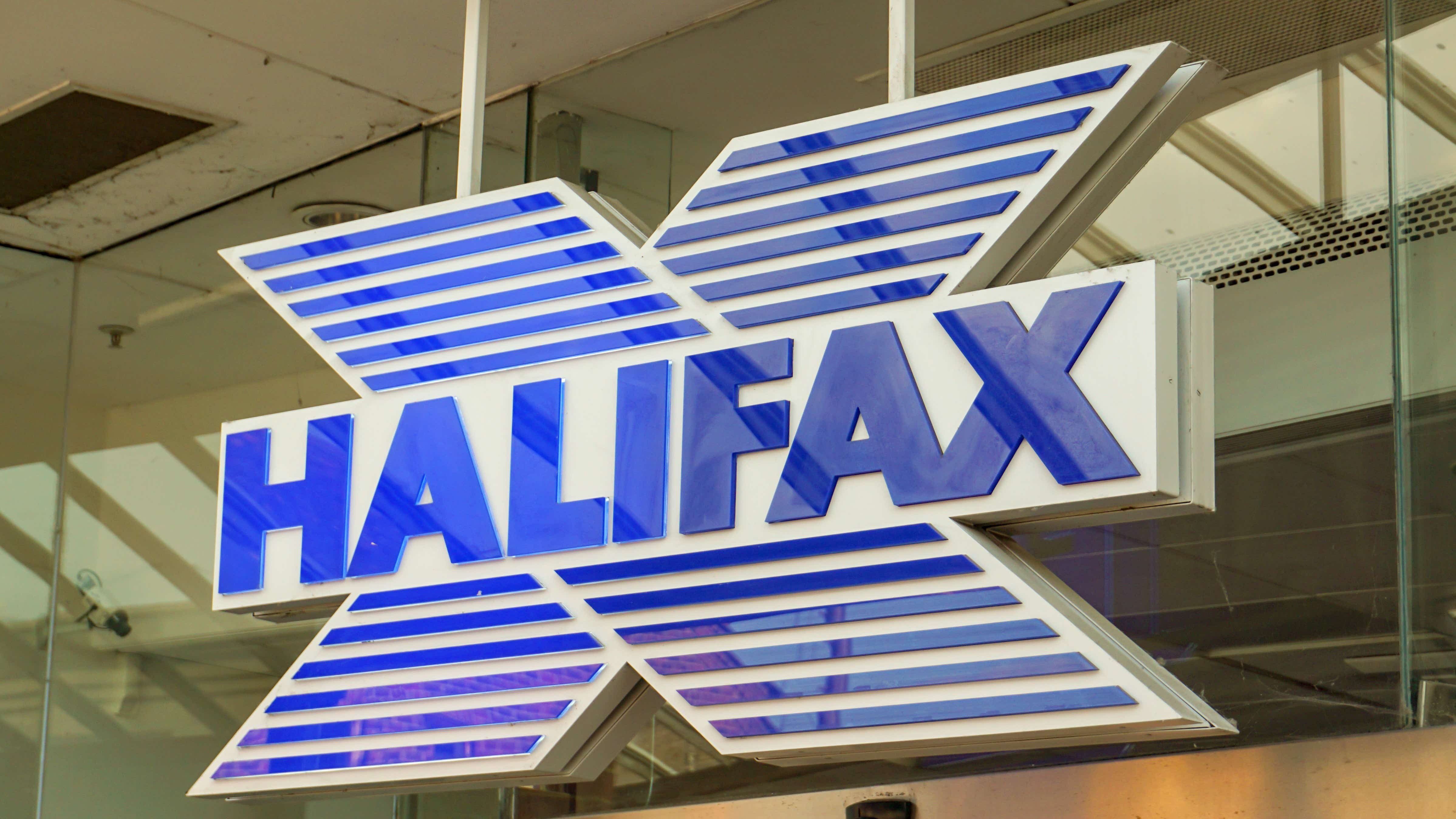 A photo of the logo sign outside of a UK branch of Halifax