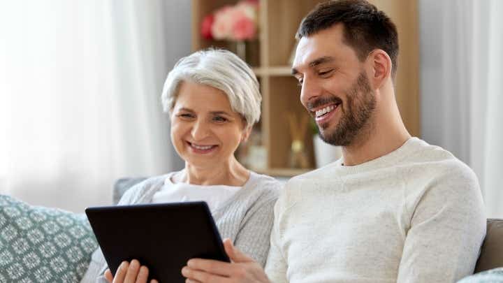 Mother and son looking at a tablet