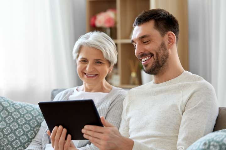 Mother and son looking at a tablet