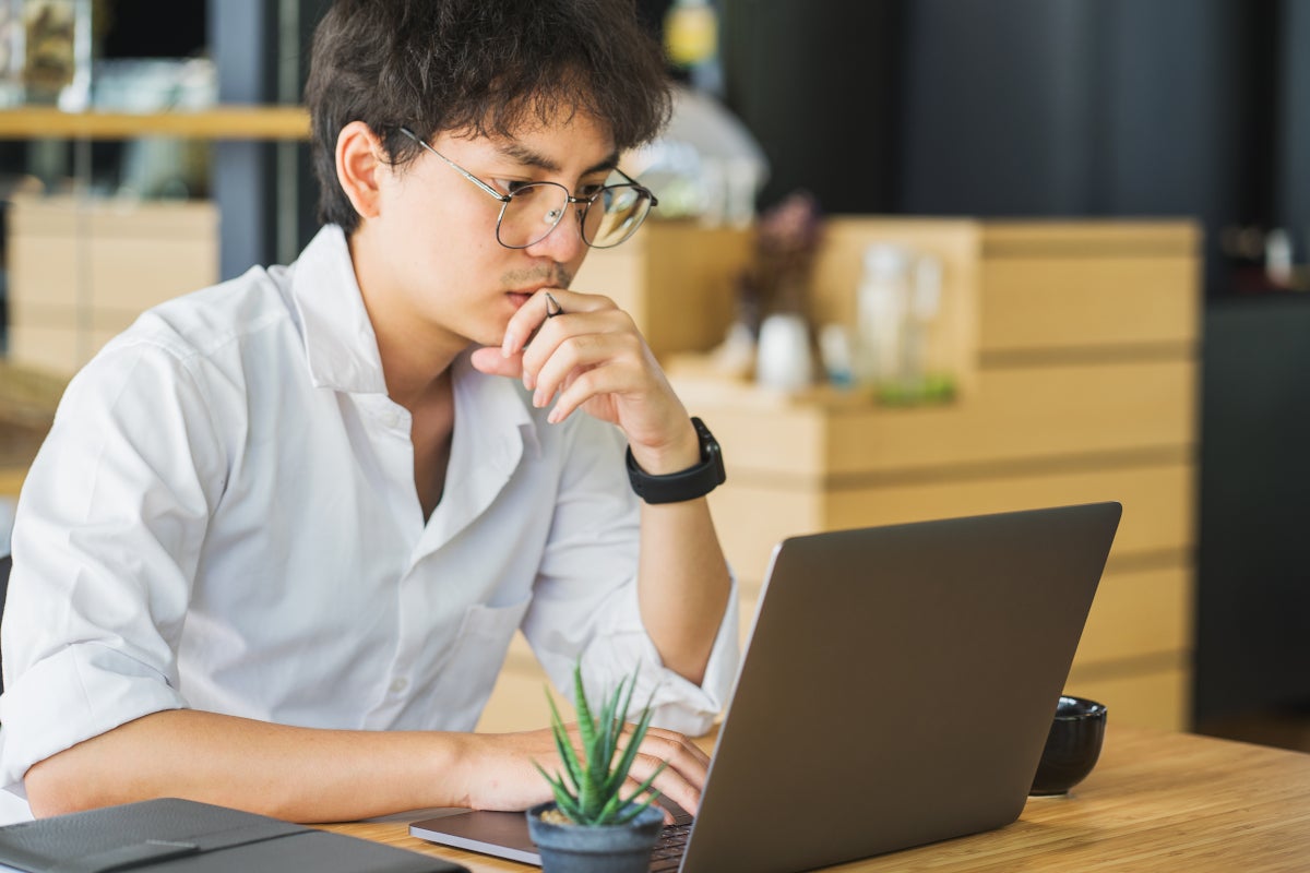 Man looking at his laptop