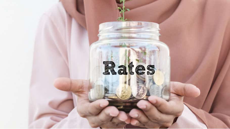 woman holding jar of coins signifying savings