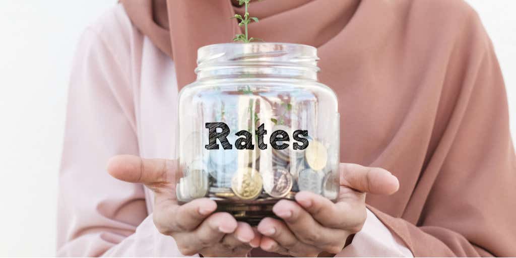 woman holding jar of coins signifying savings