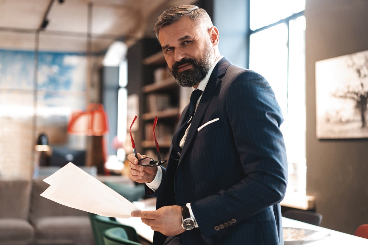Man in a suit with papers