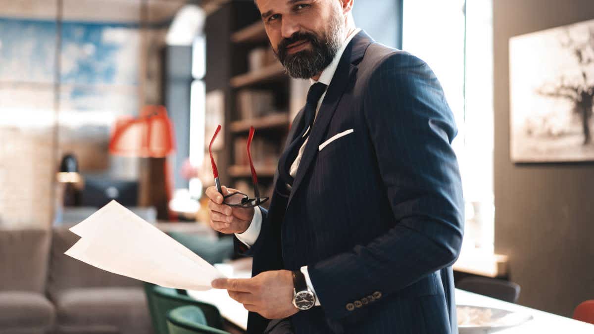 Man in a suit with papers