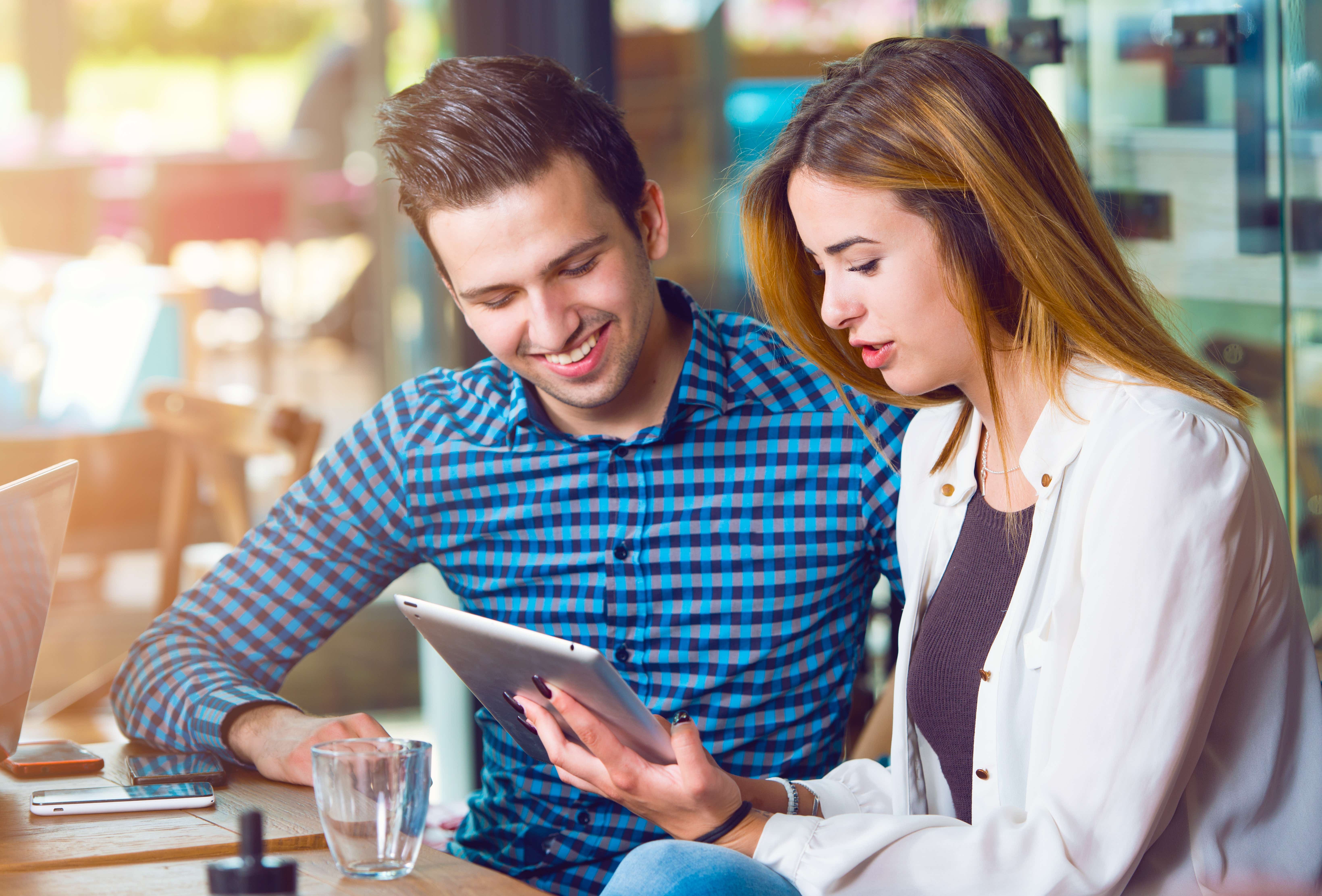 Young man and woman sitting at a table