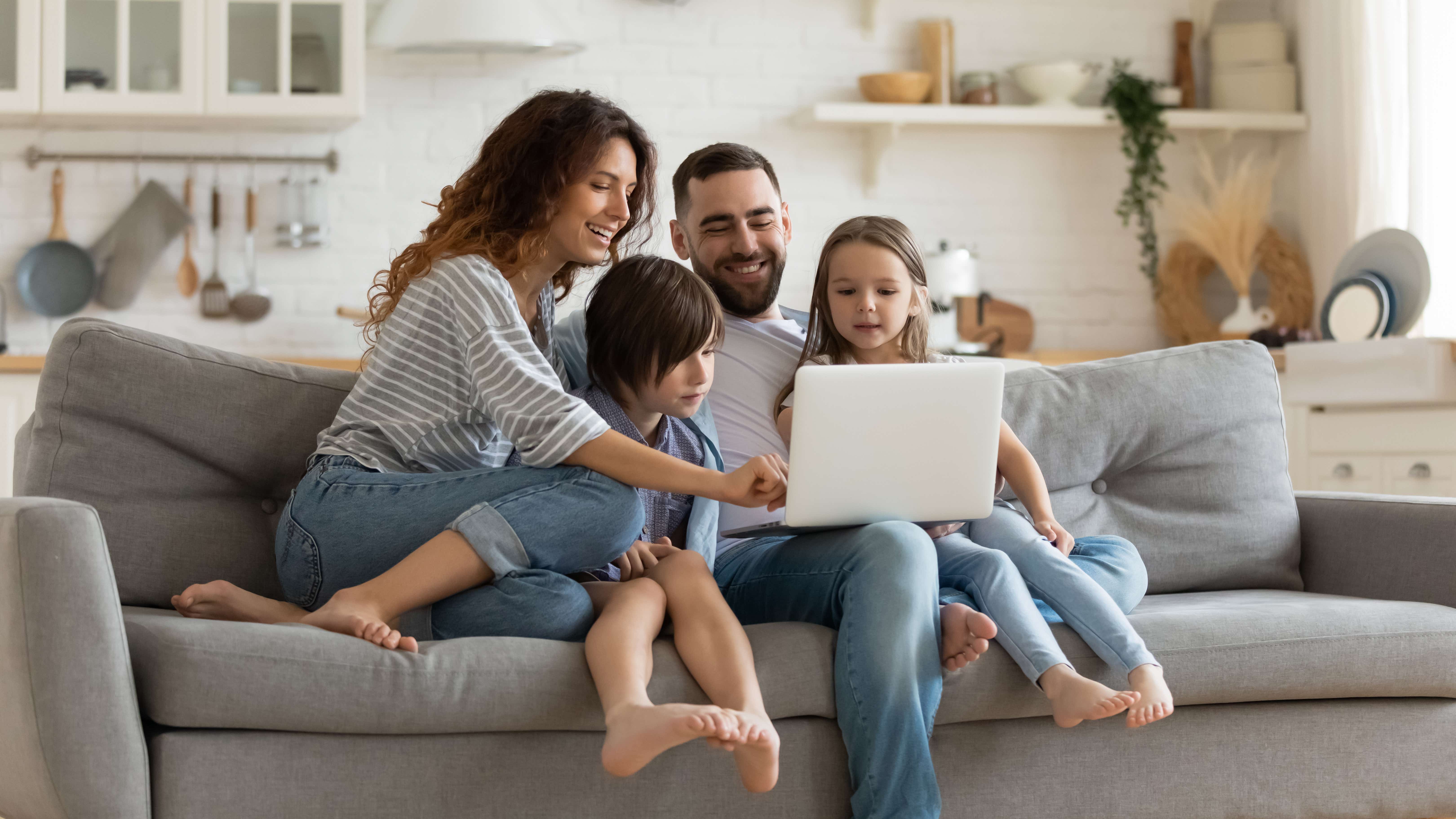 Family sharing a laptop