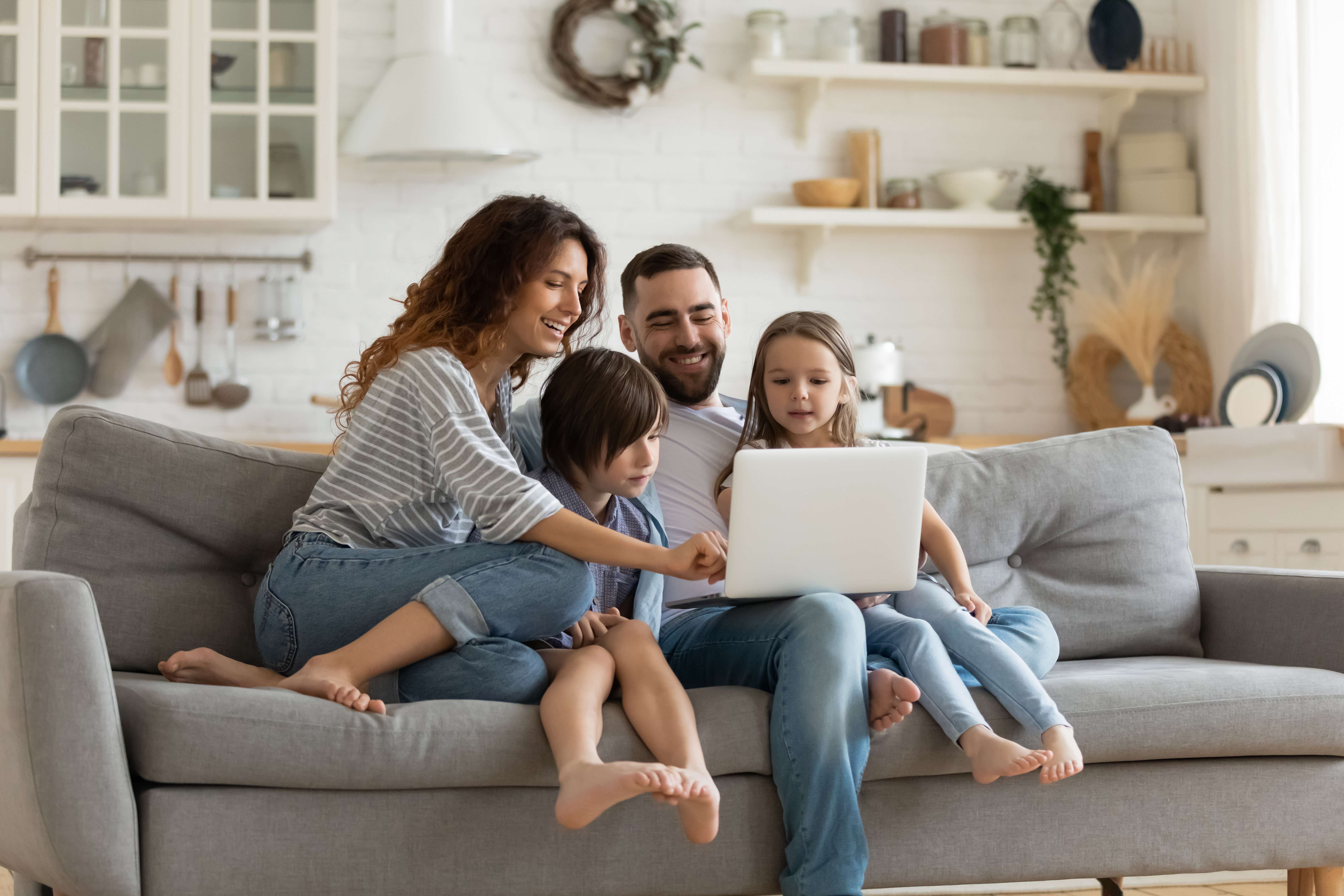 Family sharing a laptop