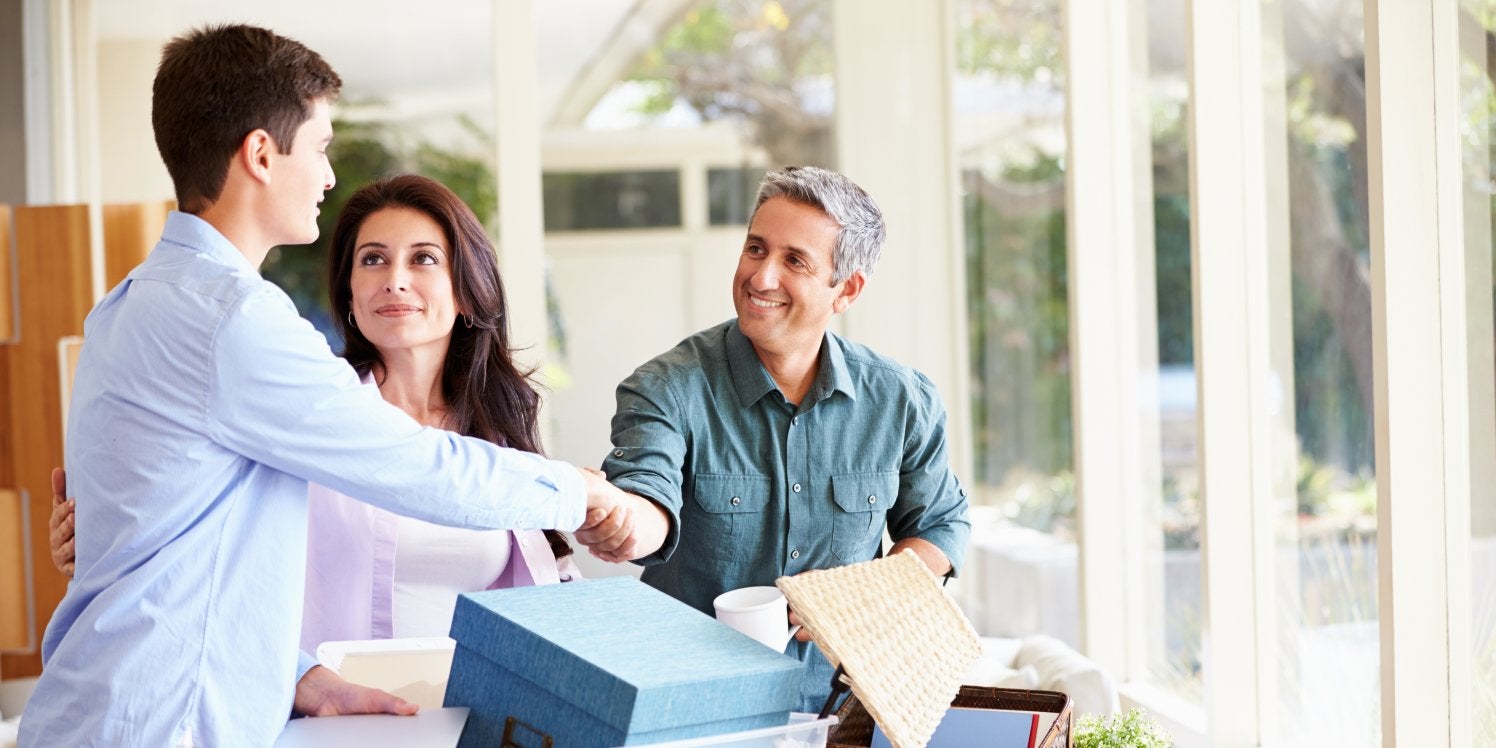 Parents helping son with packing