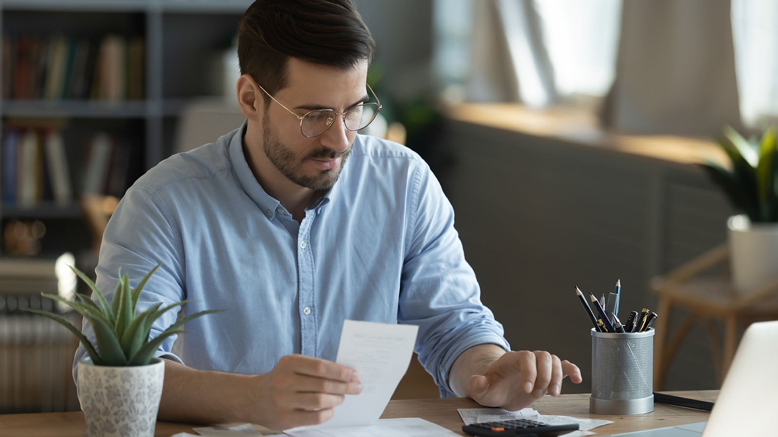 man checking bills