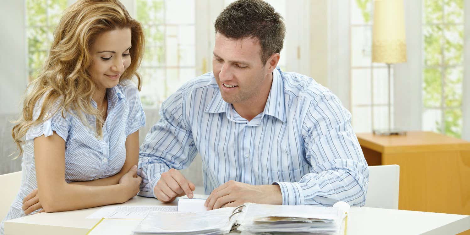 Couple doing paperwork at home