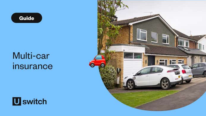 Two cars parked on a drive outside a house