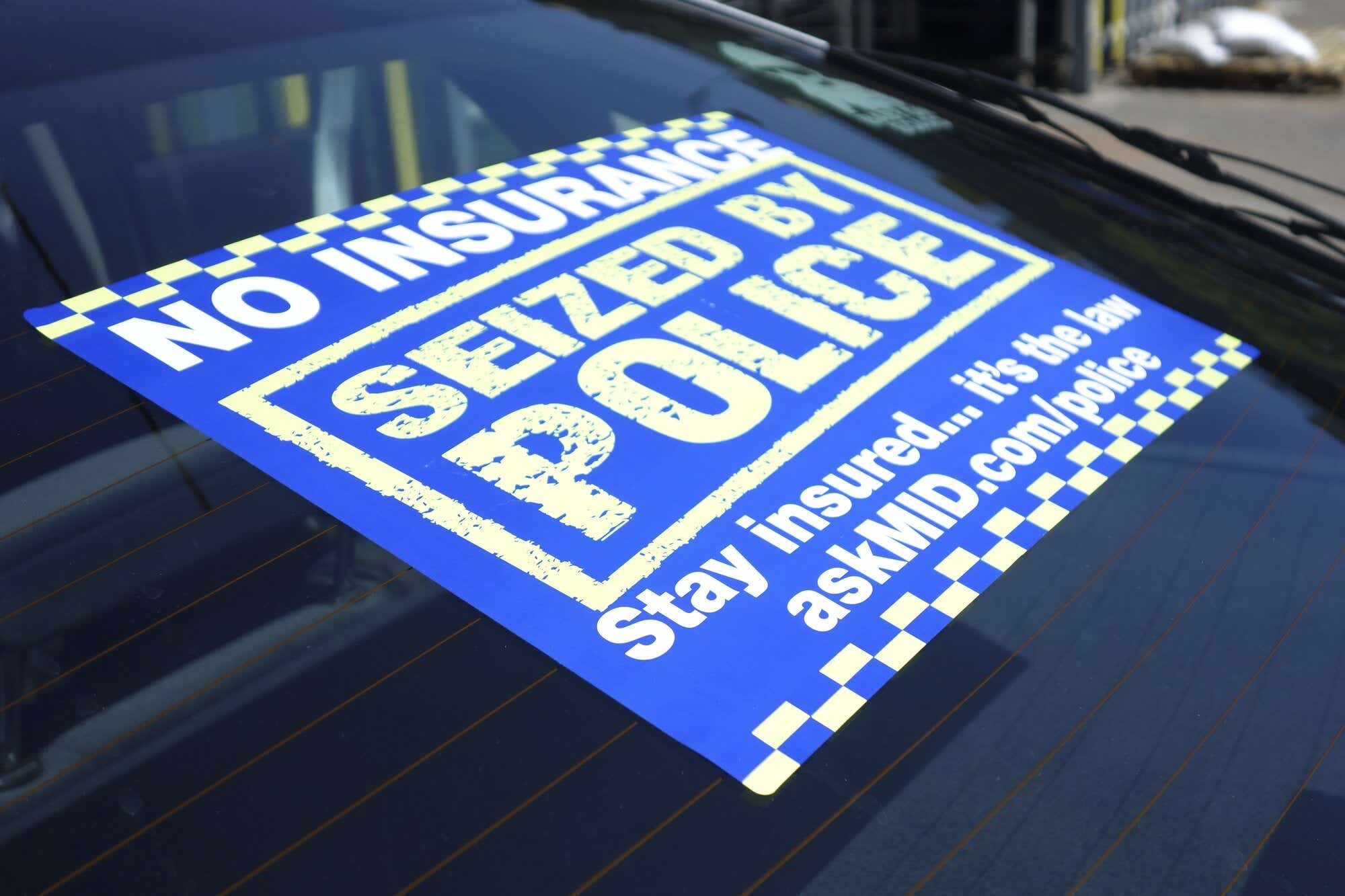 No insurance seized by police sticker on car windscreen