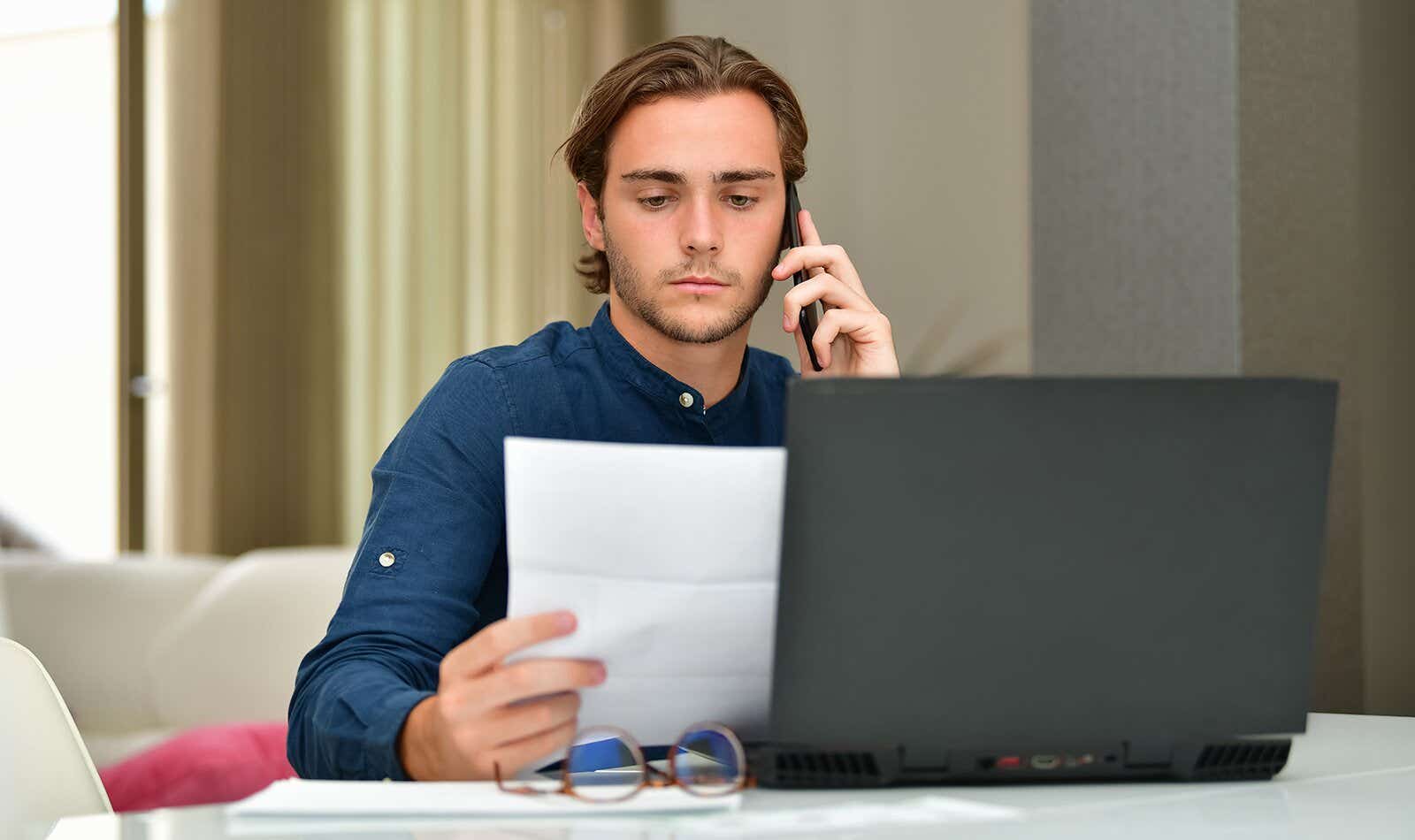 man at his laptop paying his broadband bill