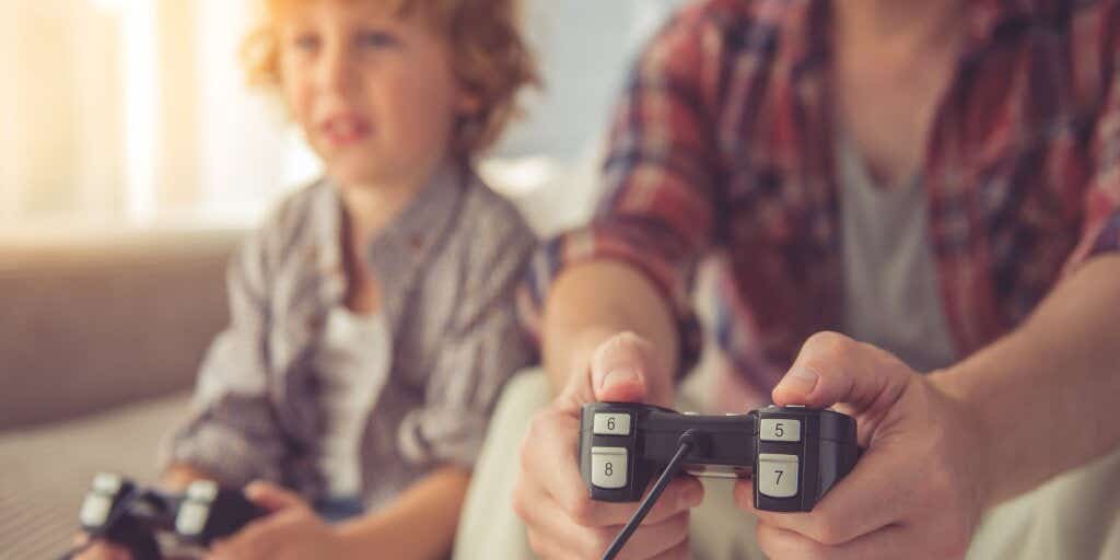 Adult and child playing computer games 