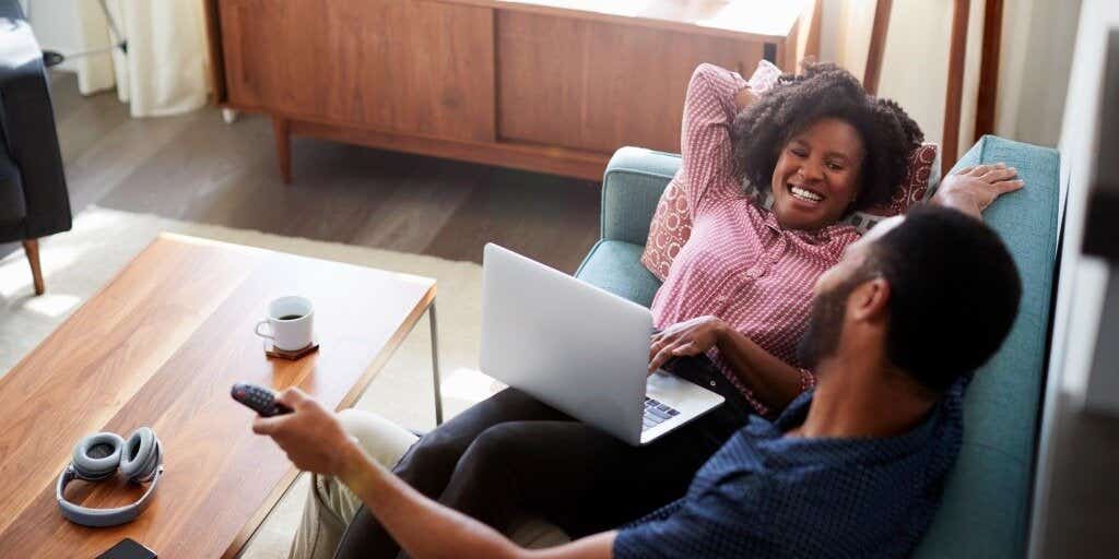 couple casting TV from a laptop