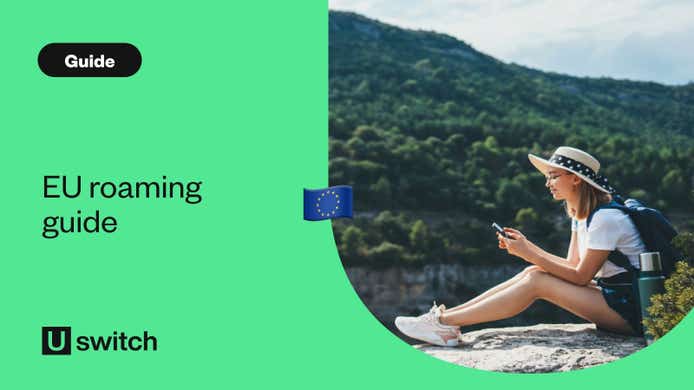 EU roaming guide - Young woman travelling by car in the mountains using smartphone