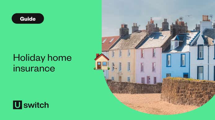 row of coloured houses in front of beach