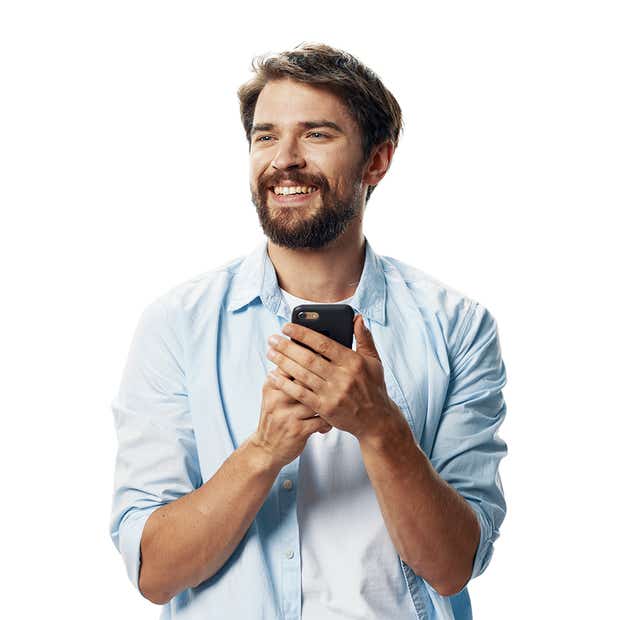 Man with phone in hand smiling