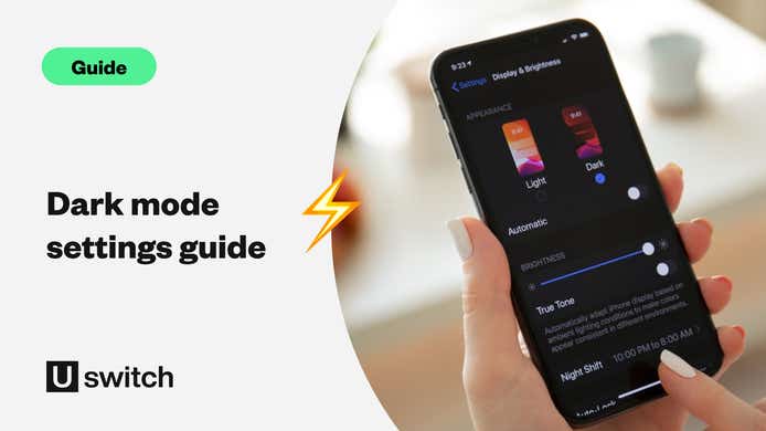 dark mode settings guide - woman's hand using dark mode on her iphone