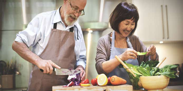 Older couple cooking