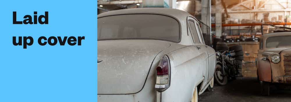  Image with the title "laid up cover" and a picture of an old car in a workshop