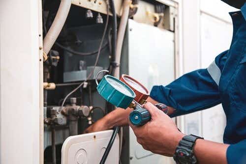 Person maintaining boiler