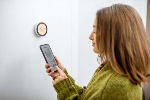 Smart thermostat woman