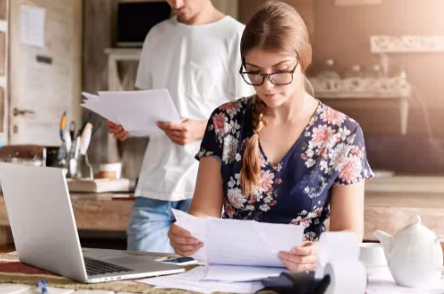 Woman looking at bills