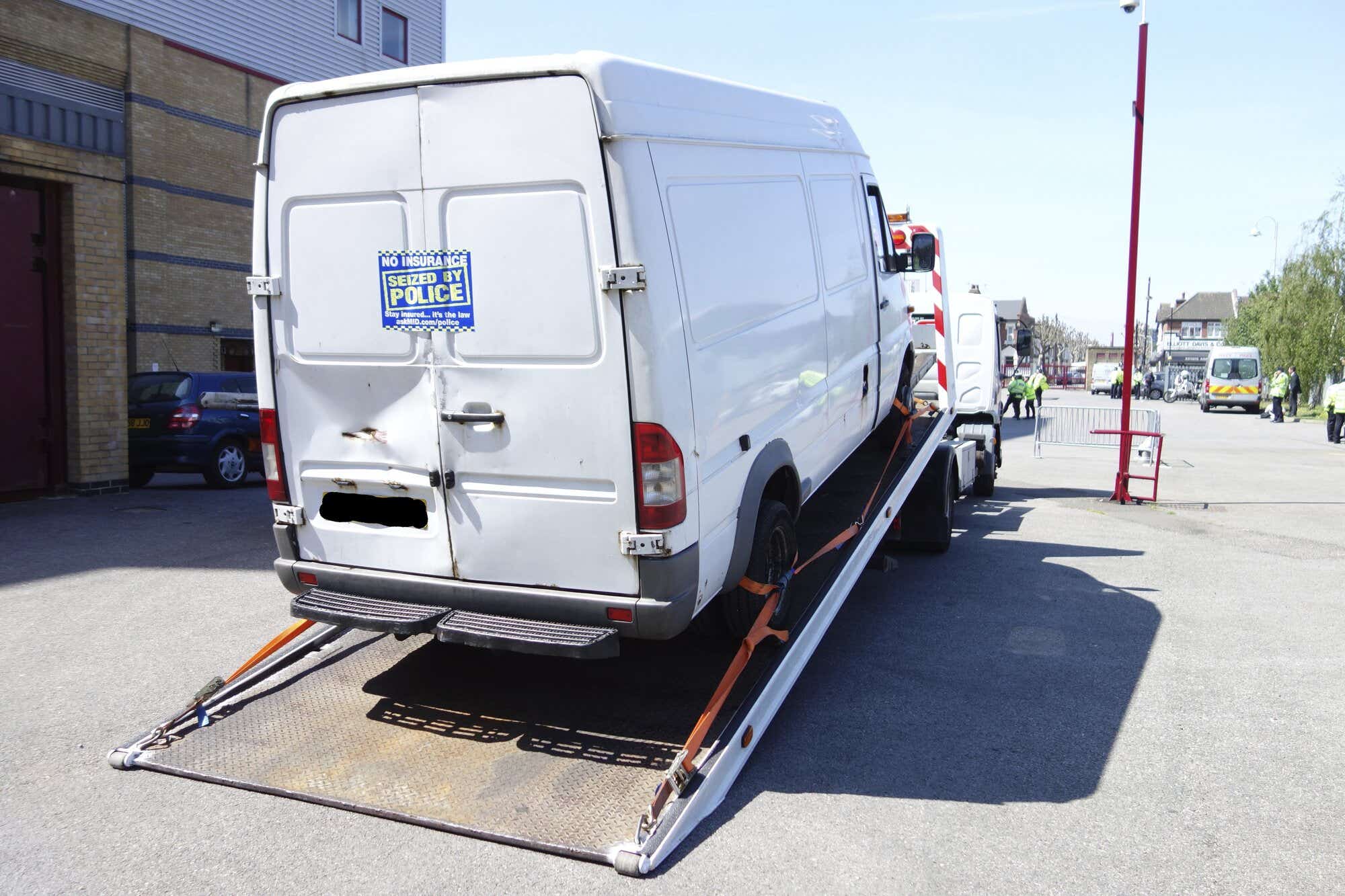 No insurance seized by police sticker on back of van