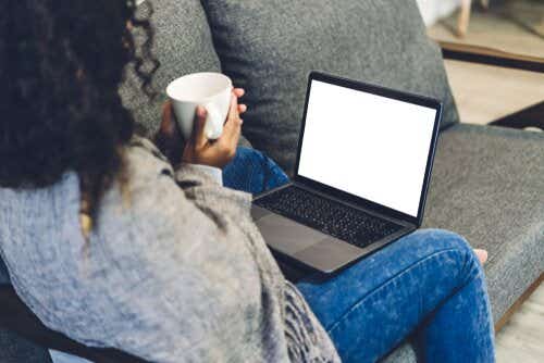 Woman looking at laptop