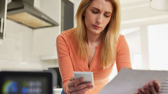 woman looking at her smart meter bill