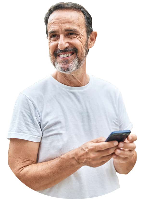 Person smiling while looking at their phone