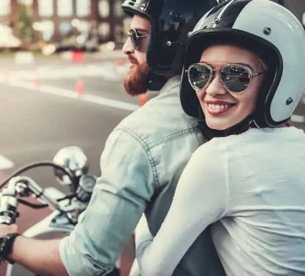 Man and woman riding motorbike