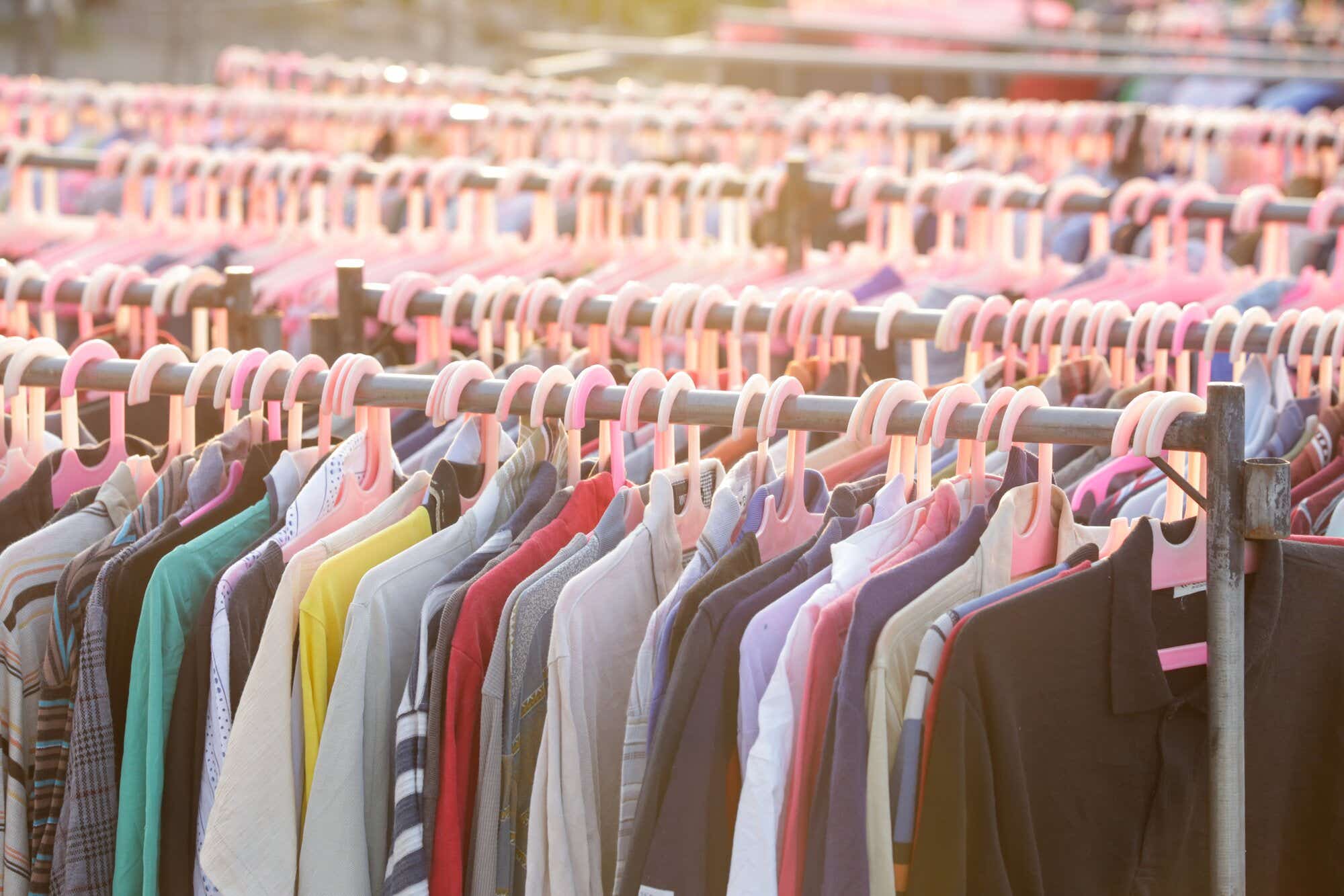 Fast fashion - lots of clothes on rails 