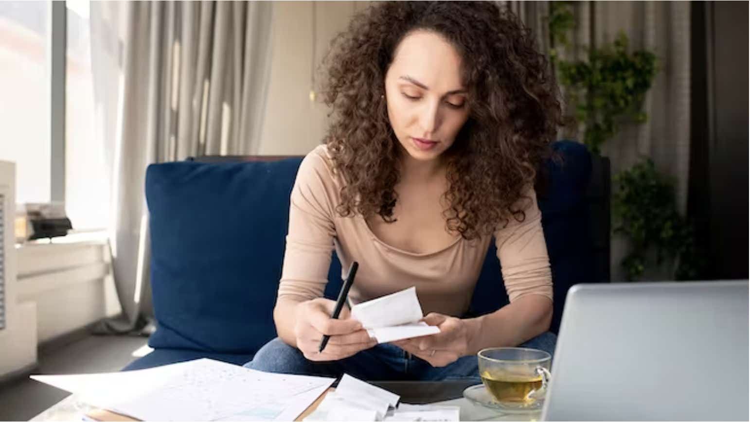 Woman looking at her bills