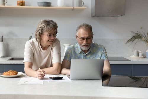 Couple looking at boiler cover online