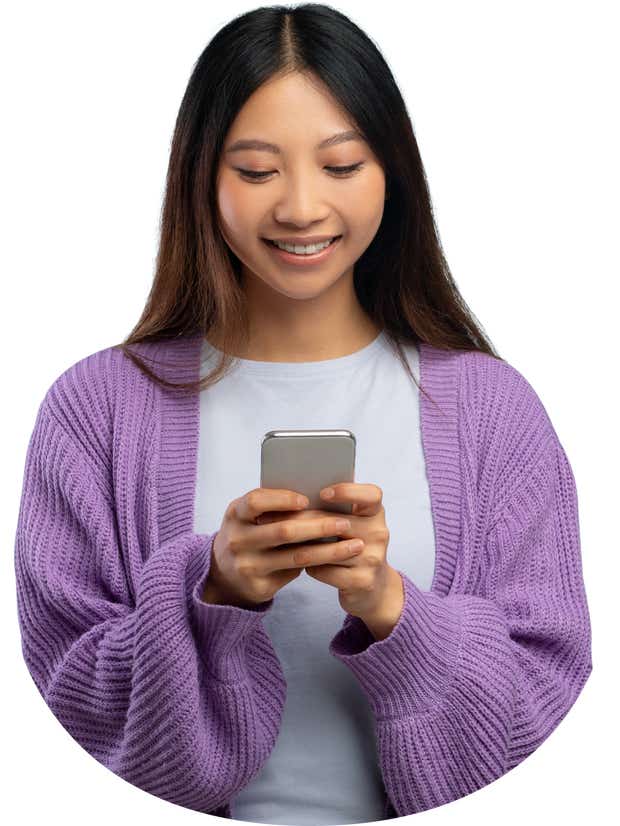 Women looking down at phone smiling