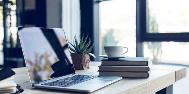 a laptop and coffee mug at home