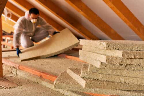 Man installing loft insulation