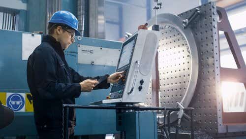 Person using machine in factory