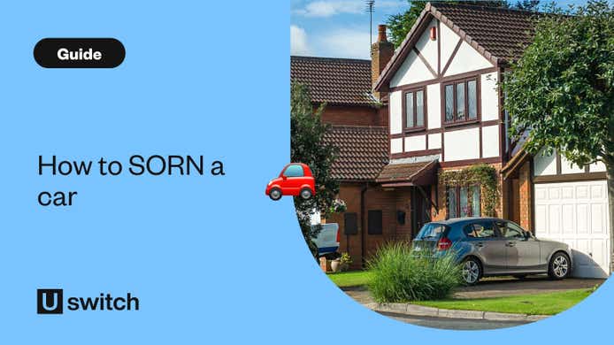 grey car parked outside modern home