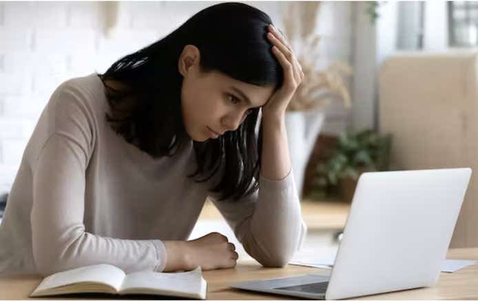 Woman stressed out on laptop