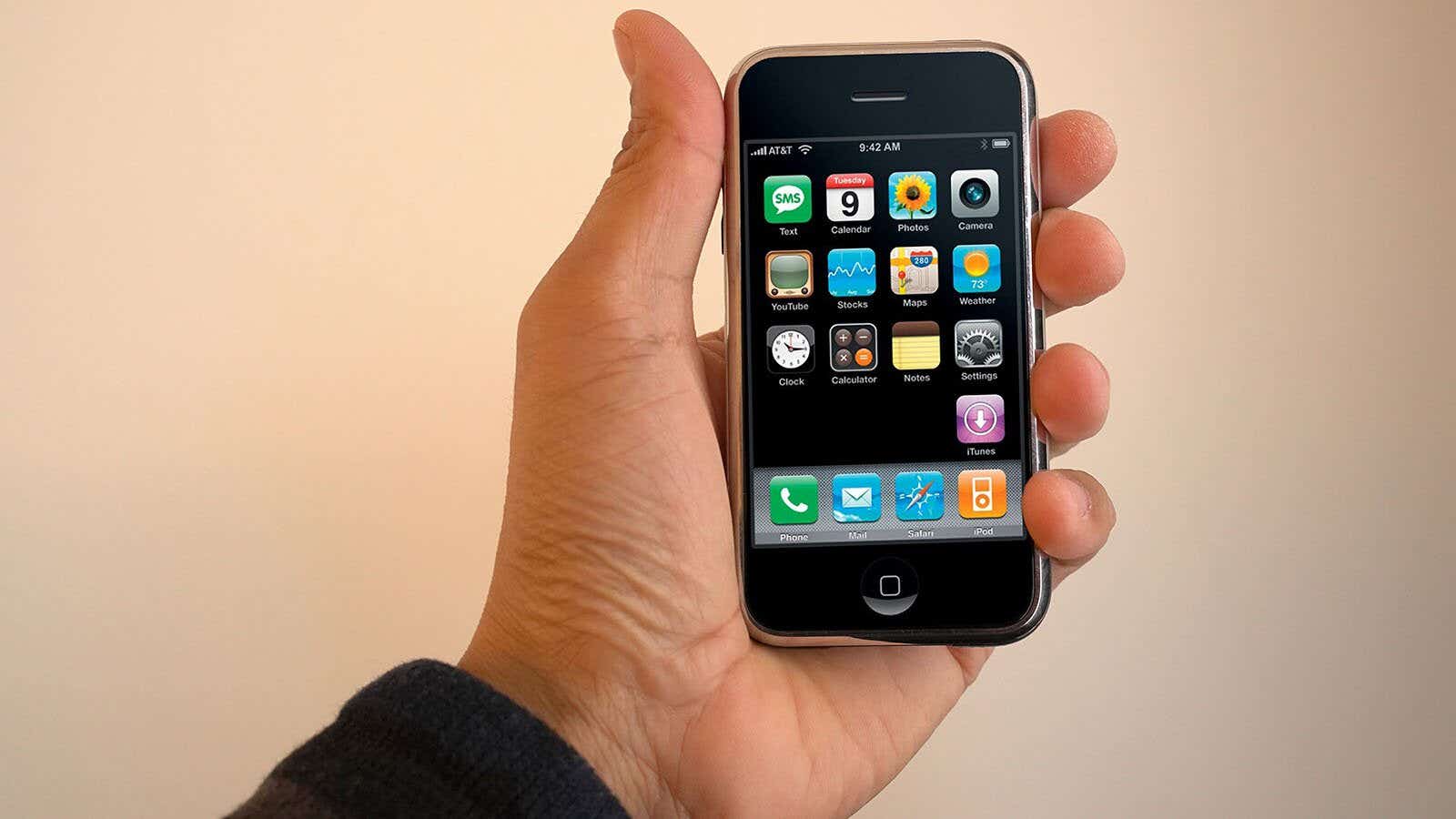 man holding the first iphone