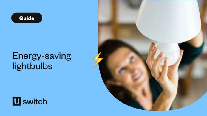 Woman screwing in new energy-efficient lightbulb