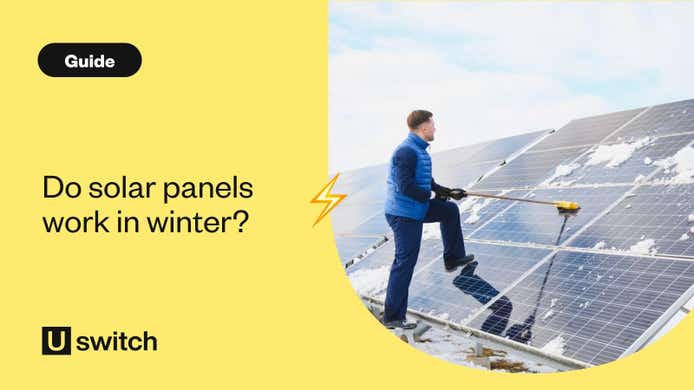 Man sweeping snow off solar panels