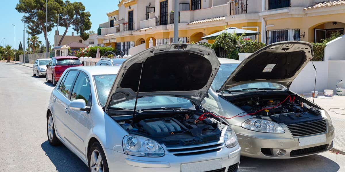 Europe breakdown - cars with bonnets up and batteries being charged