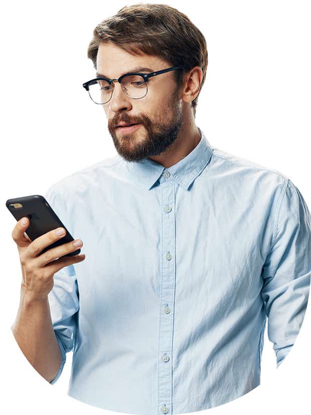 White male in glasses looking down at phone